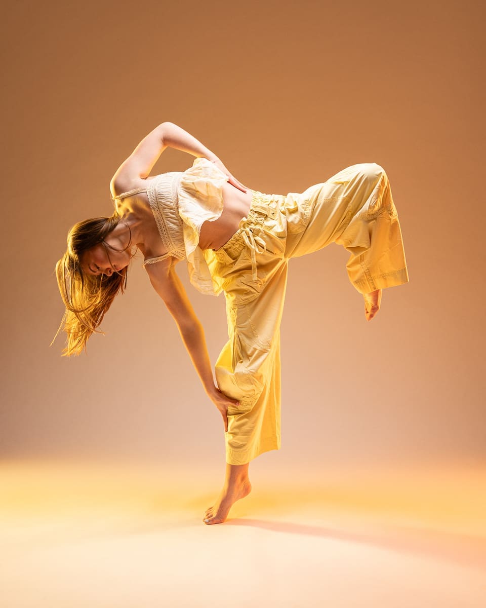A dancer executes a challenging tilt pose during while being photographed by a San Antonio dance